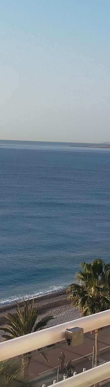a balcony with a balcony and a view of the ocean