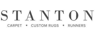 a logo for Stanton Carpet, Custom Rugs, & Runners