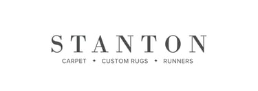 a logo for Stanton Carpet, Custom Rugs, & Runners