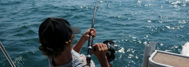 a man is fishing in the ocean with a fishing rod