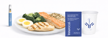 A healthy high-protein meal with salmon, chicken, eggs, and broccoli alongside Immunocal whey protein isolate and a GLP-1