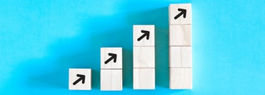 stacks of blocks getting progressively taller, representing growth