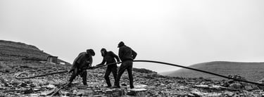 a group of men working on a mountain