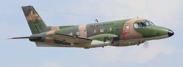 a military plane flying in the sky