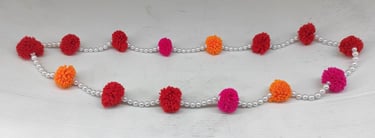 "Handcrafted artificial tribal-style necklace with multicolor flower embellishments-for global markets"