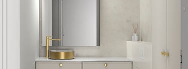 Modern minimalist bathroom featuring a gold vessel sink, floating vanity, and wall-hung toilet.