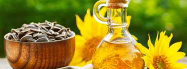 a bottle of sunflower oil with sunflowers and sunflowers