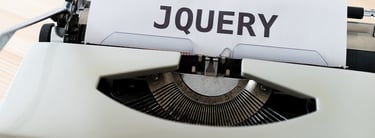 a typewriter typing JQUERY
