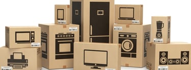a group of cardboard boxes with a computer monitor and a monitor