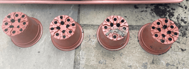 a row of flower pots overturned