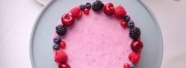 a cake with berries and berries on a plate