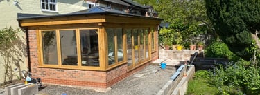 brick and wood conservatory constructed lakes building and plastering services