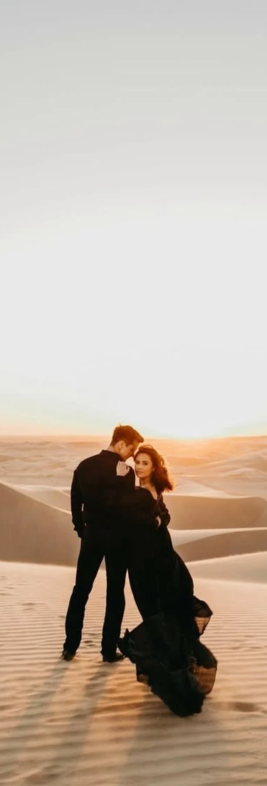 a couple kissing in the desert