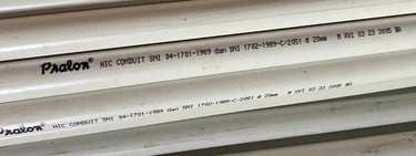 a stack of pipes and pipes in a warehouse Distributor Pralon