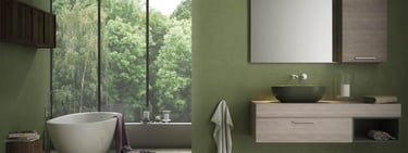 Modern green bathroom featuring a floating wood vanity, vessel sink, and freestanding bathtub by a window.