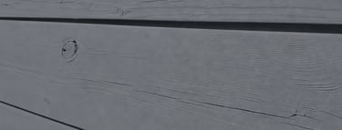wood fence with visible wood grain beneath breathable linseed oil paint