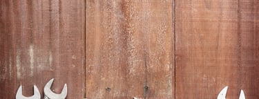 a variety of wrenches and wrenches on a wooden table