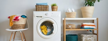 a washing machine with a basket of towels and a basket of towels
