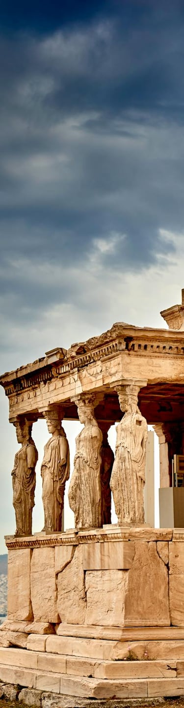 a large stone structure with statues on the side of it