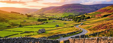  the countryside view of the Yorkshire Dales showing stone walls and stone barns