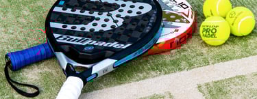 padel rackets and padel balls on a padel court