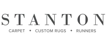 a logo for Stanton Carpet, Custom Rugs, & Runners