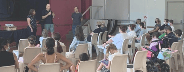 People in church listening to a person speaking