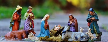 Figurines of nativity including Baby Jesus, characters, and animals