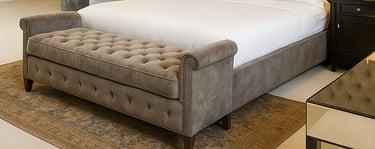 Tufted bed and bench with dark wall paneling, custom-designed by Solo Home Decor for a luxe bedroom.