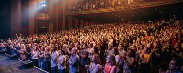 a man standing in front of a crowd of people