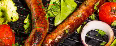 Sustainable plant-based, nutritionally-dense, hypoallergenic protein and fibre sausages with vegetables surrounding