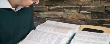 Man reading and studying the Holy Bible