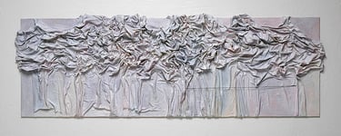 Textured mixed media wall art featuring draped, sculpted fabric in neutral tones on a long canvas.