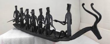 "Bastar tribal iron sculpture featuring deer-head boat and seated villagers – right view-Designed for export"