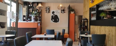 a restaurant with a table and chairs and a bar