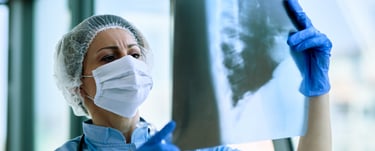 Nurse looking at the x-ray report