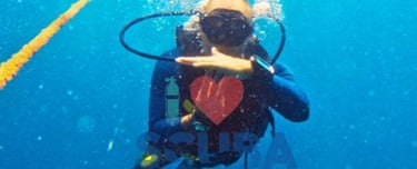 Scuba Duka diving center gift voucher featuring a scuba diver in Diani Beach Kenya with SSI logo.
