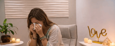 a woman in a chair with candles and candles