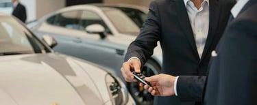 Close-up of premium car interior details showcasing leather seats and polished gold accents.