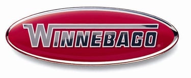 Official red oval Winnebago RV logo emblem with silver and black lettering for motorhomes.