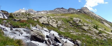 a mountain stream of water flowing down a mountain