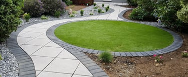 Patio with custom stone circle with aggregates and paving weaving through adventurous garden design