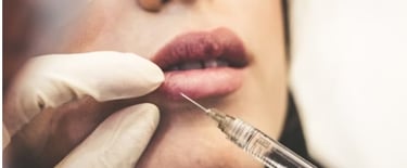 woman injecting botox into lips