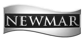 Chrome Newmar RV logo on a wavy silver background for luxury motorhome branding.