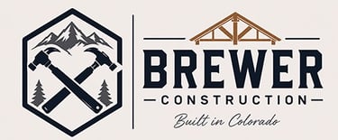 Brewer Construction logo with crossed hammers, mountains, and Built in Colorado tagline for Denver area contracting.