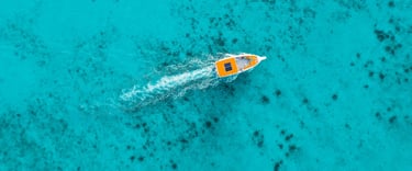 Boat in turquoise water in a tropical destination