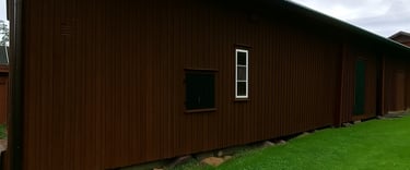 old wood barn painted with breathable paint