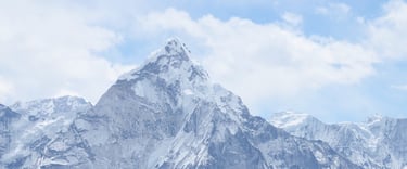 a mountain range with a few people on it