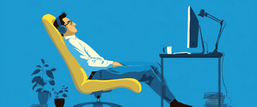 a man sitting in a chair with a computer monitor