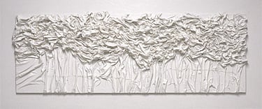 Textured white monochromatic 3D canvas wall art with draped fabric and ruffled abstract details.